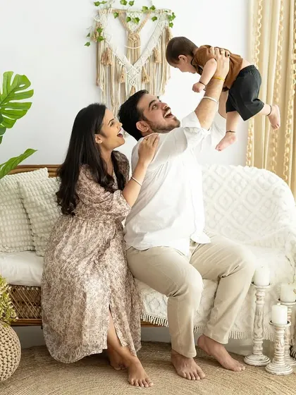 A moment of pure joy as a father lifts his baby into the air. These playful, candid shots are often the most cherished family memories.