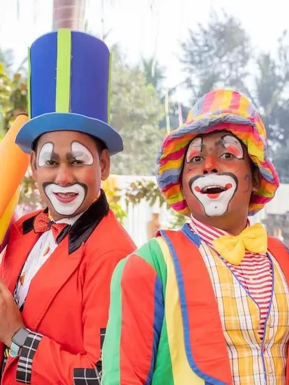 Bringing the carnival magic to the celebration. These smiling clowns were on hand to entertain guests and pose for fun photos.