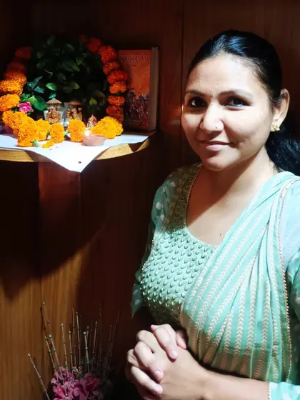 My colleague at the office shrine during our Diwali pooja.