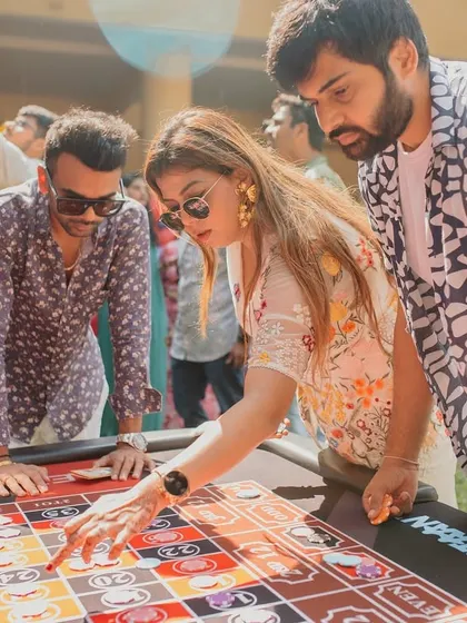 High stakes and carnival vibes. I set up fun activities like a roulette table to give guests a taste of casino fun right at the wedding.