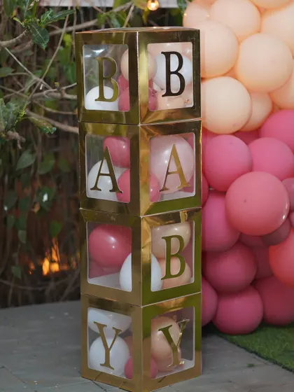 These "BABY" blocks filled with balloons are a popular and adorable prop for baby showers and first birthdays.