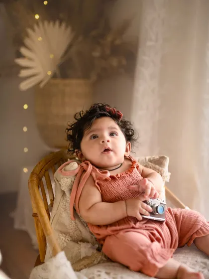 This little explorer is holding a vintage camera prop during her five-month session. I love incorporating fun elements that match the theme of the shoot.