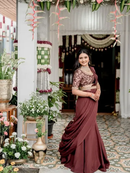 A beautiful client dressed in my custom-made fish-cut skirt in a rich maroon. I paired it with an embroidered blouse and a belted, draped dupatta to complete the modern fusion ensemble.