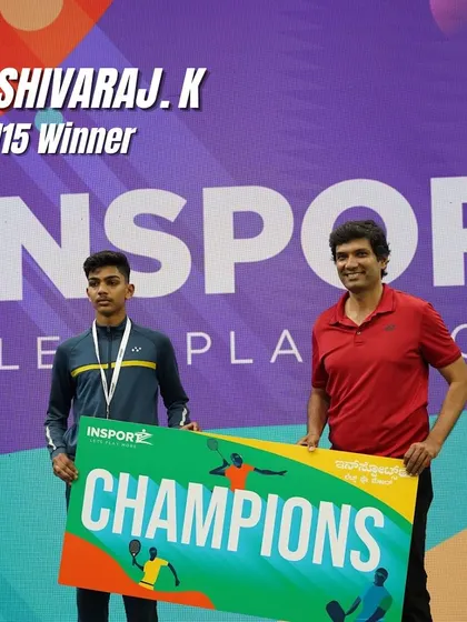 Shivaraj K. holding the champions banner as the U-15 winner. We train our players to aim for the top spot in every tournament.
