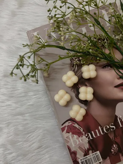 Our mini bubble or 'blob' wax melts, styled on a magazine for an aesthetic shot.