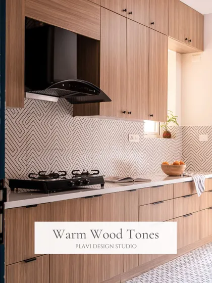 Warm wood tones bring a natural and inviting feel to this kitchen. Paired with a geometric backsplash and clean white countertops, the look is modern, warm, and timeless.