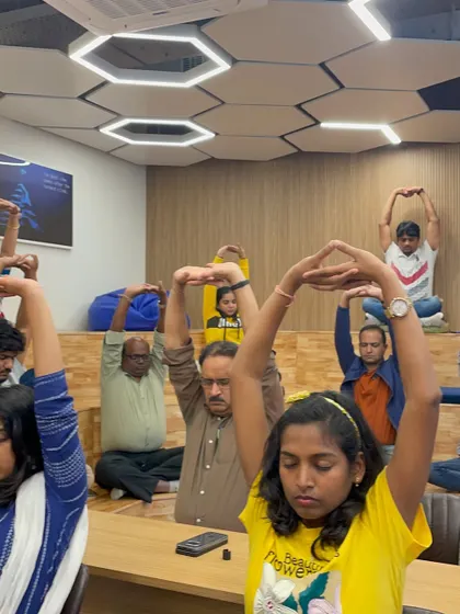 This simple overhead arm clasp is an effective stretch for the shoulders and upper back. It can be easily done while seated, making it a perfect tool for a quick corporate wellness break.