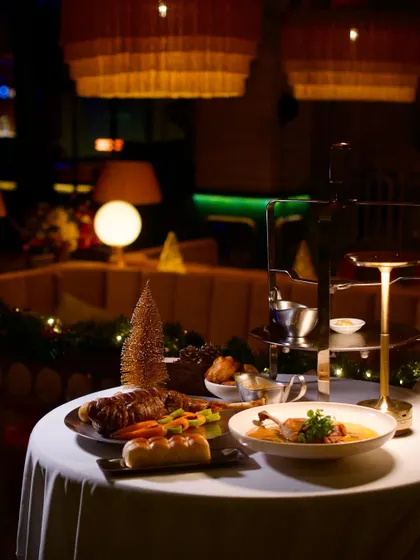 A beautifully set table from a previous Christmas, featuring our special holiday menu. The ambiance is cozy, festive, and perfect for a holiday feast.