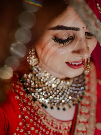 An emotional, candid moment of the bride during the ceremony. The bokeh from the lights adds a magical touch to this heartfelt shot.