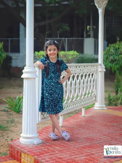 Feeling blue in the best way! This young model looks so confident and stylish posing in her beautiful blue dress during a collaborative photoshoot.