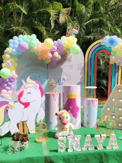 This outdoor unicorn party uses soft pastel colors and a rainbow arch to create a dreamy, magical atmosphere.