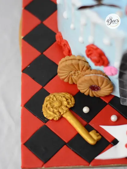 No detail is too small, like the golden key and jam-filled biscuits on the checkered floor.