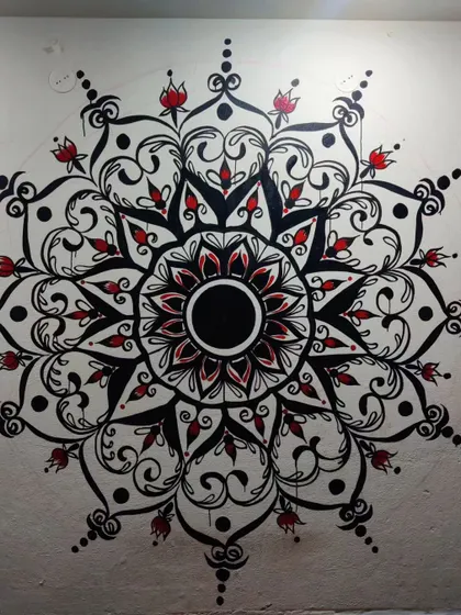A full view of the black, white, and red mandala mural. This design combines floral-inspired motifs with geometric precision, creating a balanced and beautiful piece of wall art.