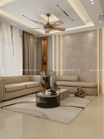 This living room design uses textured wall panels and strategic backlighting to create a warm and inviting ambiance. The layout is spacious and perfect for relaxation.