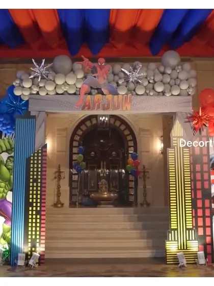 The grand superhero entrance at night, with the illuminated cityscapes and character cutouts creating a dramatic effect.