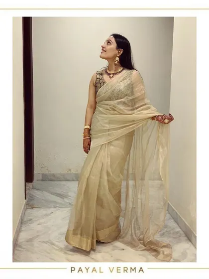 A client looking classic and elegant in a gold tissue saree paired with a pure Banarasi silk blouse. This photo was taken during a fitting at my studio.