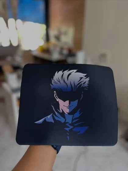 A custom Gojo Satoru mousepad for an anime fan. I can print any design you want to make your workspace more you.