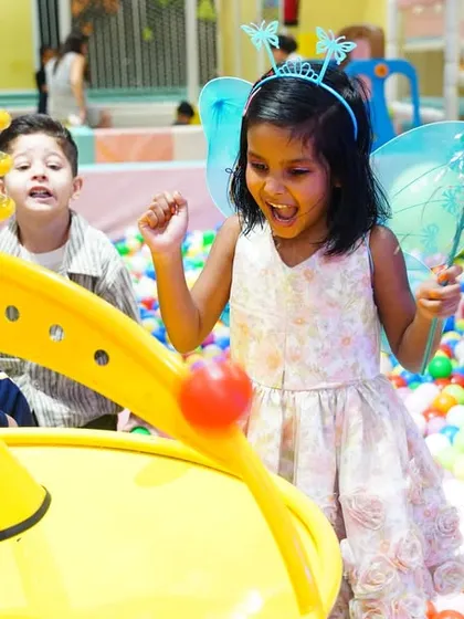 A little fairy having a blast in the ball pit, showing how our play zones are integrated into every themed party.