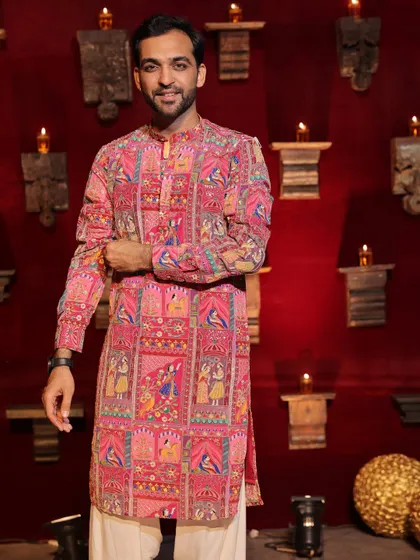 Posing before a big Navratri night. The backdrop of diyas and the traditional decor sets the perfect mood for a night of devotion and dance.