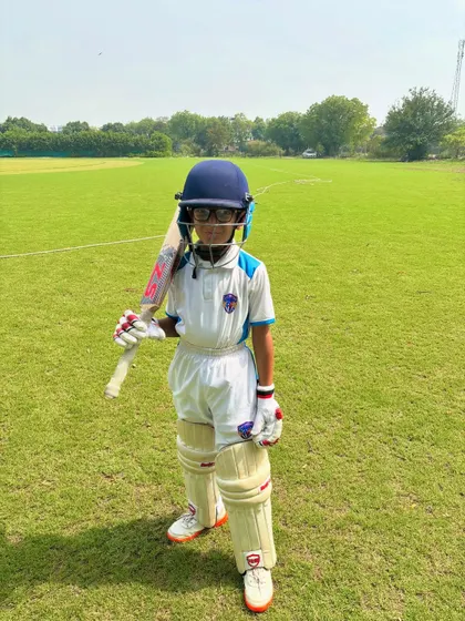 A confident pose from our little champion. The passion for cricket starts young.