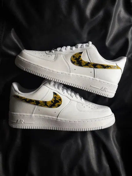 A top-down view of the leopard swoosh custom sneakers.
