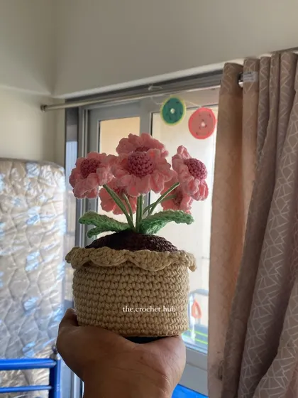 Here is the same pink multi-flower pot by the window. It shows how my handmade decor can bring colour and life to any room, no matter the setting.