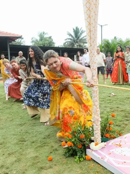 A Haldi isn't complete without some fun and games. We organized a tug-of-war at Sonam and Ross's outdoor gala, a perfect way to get everyone involved and laughing.