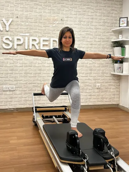 Various shots of members and instructors in action during our dynamic Reformer Pilates classes.
