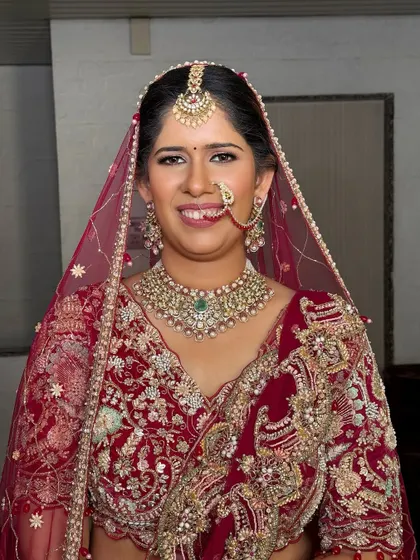 A classic portrait. The makeup is balanced to look stunning with her heavy jewelry and ornate outfit.