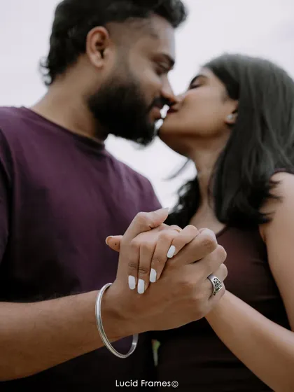 A close-up on their hands and near-kiss, focusing on the details of intimacy and connection.