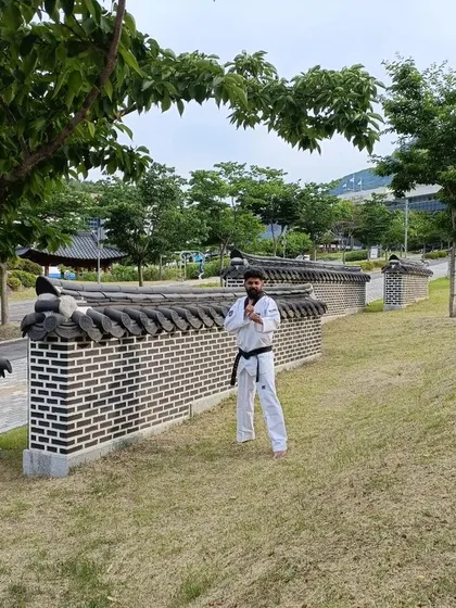 A quiet moment of reflection by a traditional wall in the beautiful landscape of Muju.