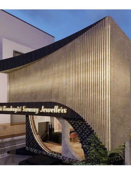 The corner view at night highlights the building's volume and form. The lighting strategy was designed to wrap around the structure, ensuring it remains a visually striking object from multiple vantage points.