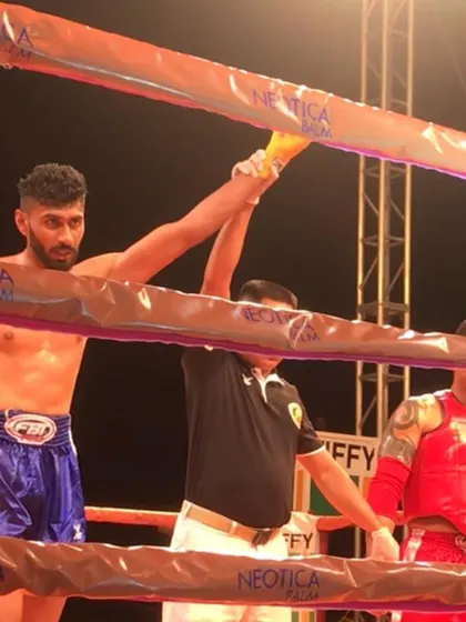 My hand raised in victory in a professional fight. I have lived the life of a fighter.