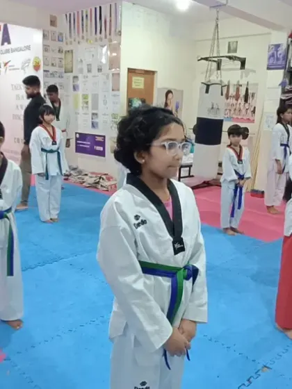 Students of various belt levels practicing together, creating a supportive learning environment.