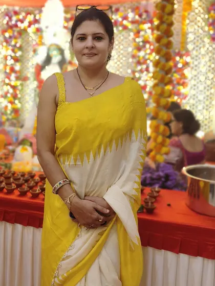 For a Kali Pooja event, I wore this elegant yellow and white saree with a simple, modern blouse design.