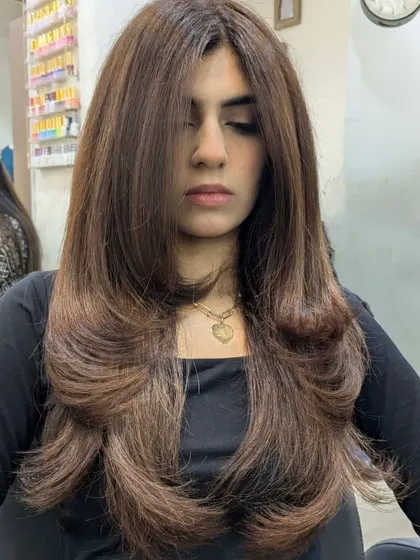 The front view of this expertly executed layered cut and blowout. It’s a timeless style that is both glamorous and easy to manage.