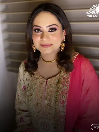 A smiling shot of the client, looking confident and happy with her final look.