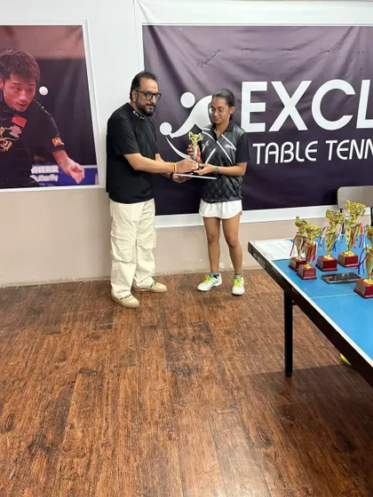 A player from our academy receives her trophy for securing 3rd place in the Under-15 Girls category at a tournament with over 160 participants from across Delhi NCR.