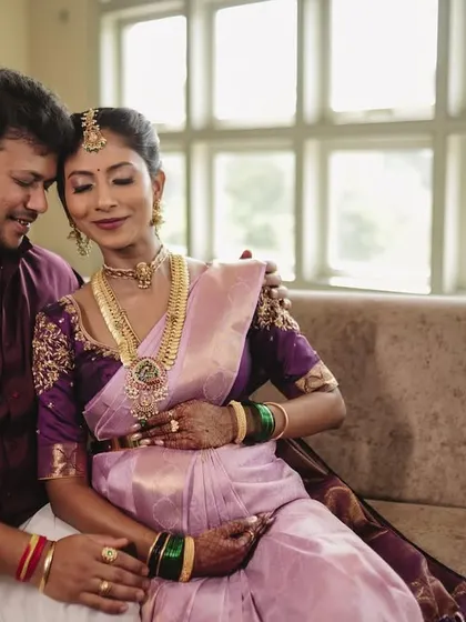A sweet and intimate moment between the couple at their baby shower. The makeup looks soft and romantic.