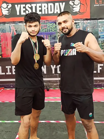 A young champion with his two gold medals, earned through dedication and hard training at our gym.