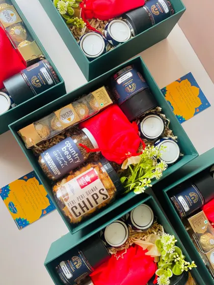 Handling bulk orders is our specialty. Here you can see a batch of our green gift boxes, each curated with gourmet snacks, chocolates, and festive diyas, ready to be sent out for a corporate Diwali celebration.