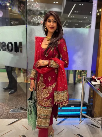 A classic red suit is a powerful statement. For this look, the rich embroidery and deep color do all the talking. I styled it with minimal jewelry to let the craftsmanship shine, creating a look of effortless elegance.