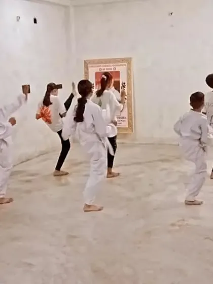A student executes a clean side kick (yoko geri). We focus on height, power, and retracting the kick quickly.