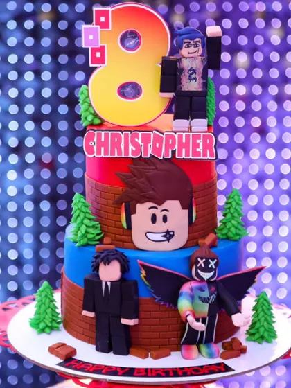 A three-tier Roblox cake for Christopher's 8th birthday. The birthday boy even helped design his own avatar for the cake, making it extra special.