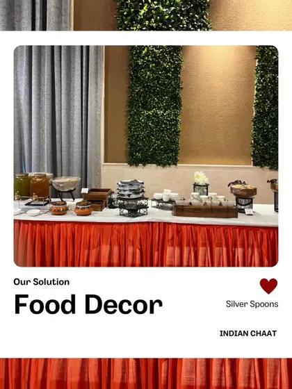 Our food decor for an Indian chaat themed event, showcasing a clean and organized buffet table with a red skirt and green hedge backdrop.