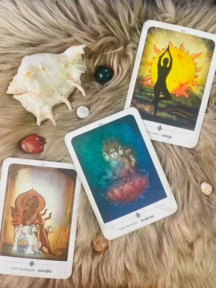 Here is a spread from my TarotGita deck, which connects tarot archetypes to Hindu deities. The Emperor as Prajapati, The World as Brahman, and The Sun as Surya, showing the deep connections between these wisdom traditions.