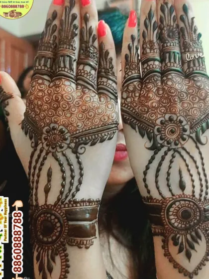 A beautiful jewellery-style mehndi design. The patterns mimic bracelets and hand chains, creating a very delicate and elegant look.