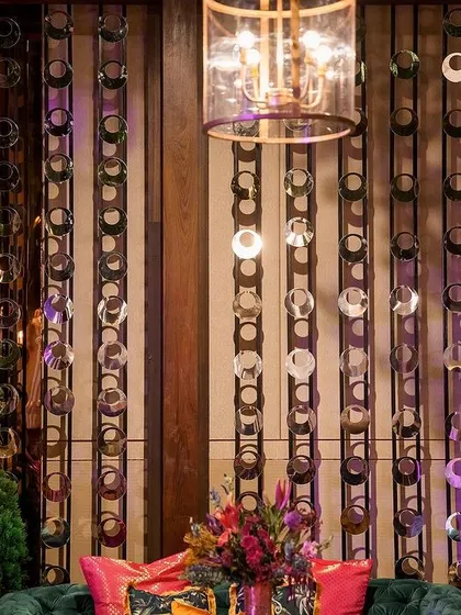 Golden leopard statues stand guard over plush velvet seating at this opulent Sangeet. These bold, thematic details are part of how we bring a client's unique personality and vision to life.