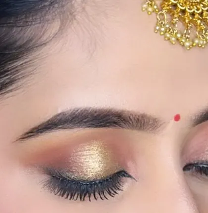 A detailed shot of a bronze and gold smokey eye. This is a great way to add drama and sophistication to any bridal look.