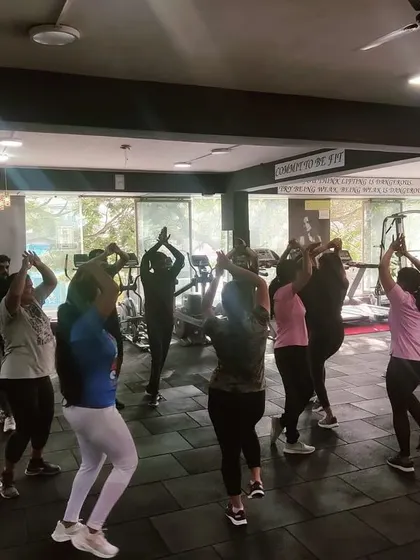 The group learning a new routine. We keep the choreography simple and fun so everyone can follow along.